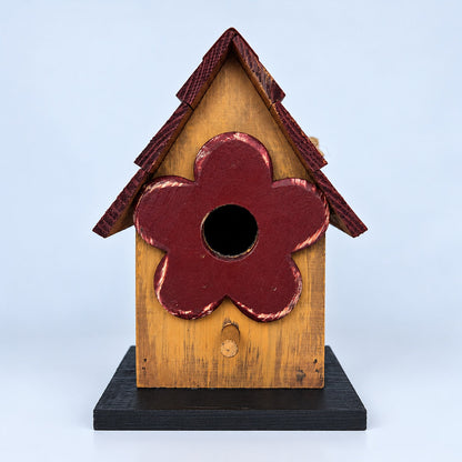 Small natural wood birdhouse with red flower entrance